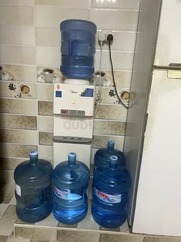 Used Water Dispenser with 4 x 5L Bottles - Hot  Cold