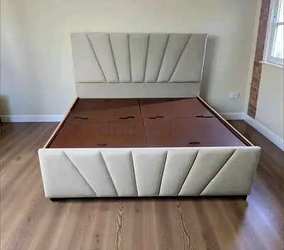 Queen-sized upholstered bed frame with storage base - beige