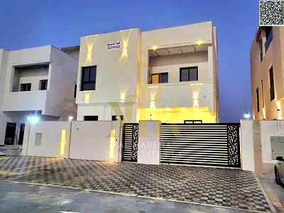 Luxury villa facing a garden and mosque in Al Bahia, with high-end stone finishing, price includes registration fees.