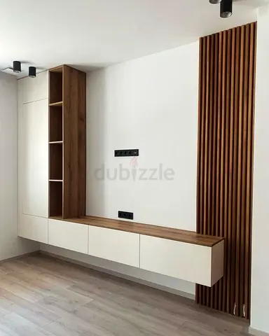 Modern wall-mounted TV unit with wood slat feature