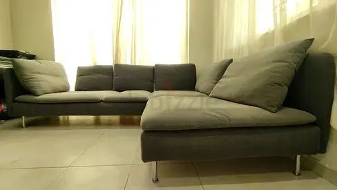 Grey L-shaped Fabric Sofa with Cushions - Good Condition
