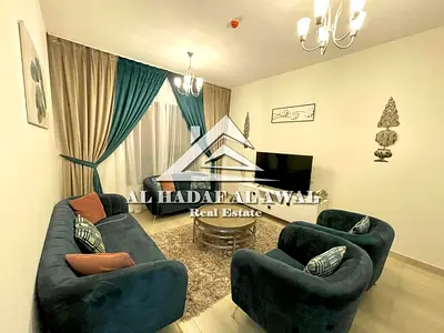 Two bedrooms and a living room for monthly rent in Al Taawun area, with free internet, parking, and gym access.