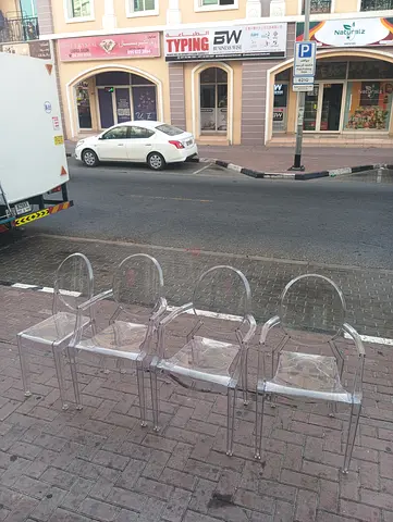 Set of 4 Clear Acrylic Ghost Chairs - Good Used Condition