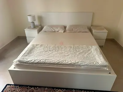 White Modern Queen Bed Frame with Two Nightstands, and 4 storage boxes in bed plus mattress.