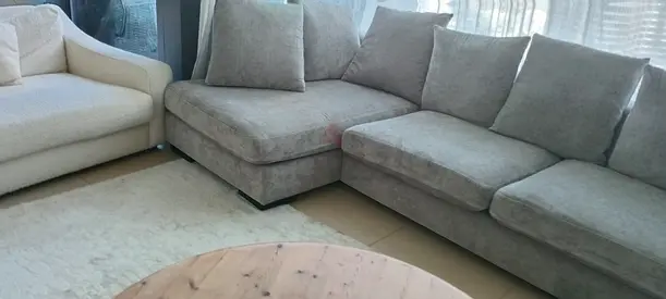 Light grey L-shaped fabric sofa set with matching rug - good condition