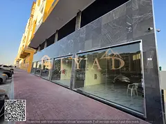 5 commercial shops for annual rent in Al Muwaihat 3, Ajman, on the main road, different sizes, compe