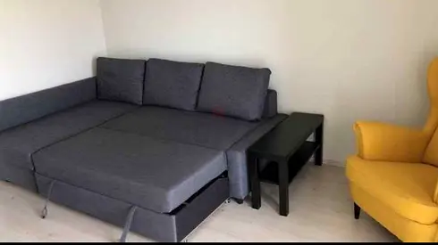 Gray L-shaped Sofa Bed with Cushions (Good Condition)