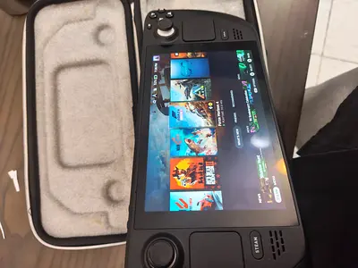 Steam Deck (handheld PC) in excellent condition with case