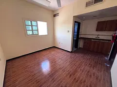 A separate kitchen studio apartment in Al Rashidiya 2 with a suitable size for family living.
