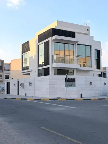 For sale in Al Zahia, Ajman: a villa with four master bedrooms, a living room, a majlis, and a maid's room.