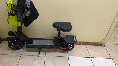 Used electric scooter with seat — comfortable city commuter and charger
