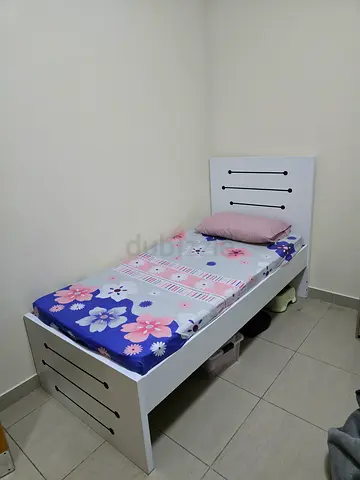 Single white wooden bed with floral mattress - good condition