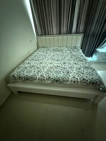 king size bed frame with mattress  along with mirror table and side table.
