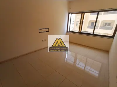 A 1-bedroom apartment with a living room for annual rent in Al Alia – Ajman, featuring a practical