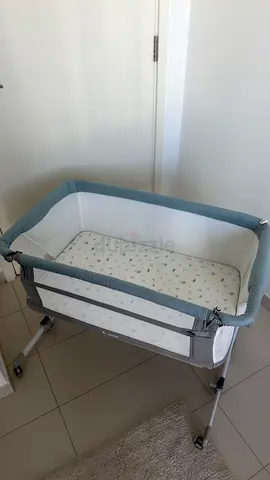 Used bedside bassinet / newborn crib — grey  white. Clean condition