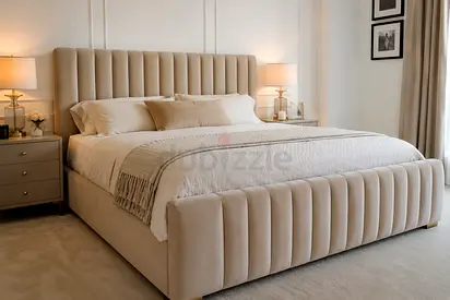 Beige Upholstered King Bed with Padded Headboard and Footboard