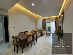 A luxurious two-bedroom apartment with a living room, fully furnished with high-end furniture, inclu