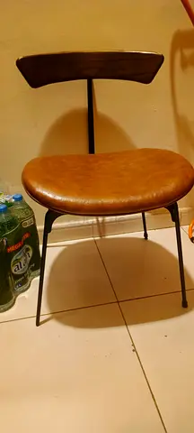 Vintage-style brown leather dining/side chair with metal frame