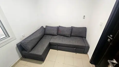 L-shaped grey fabric sofa with storage, good condition