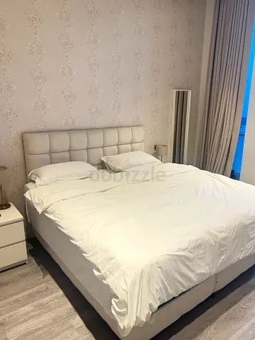 King upholstered bed with padded headboard - good condition