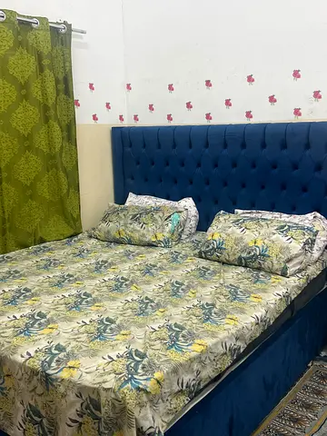 King size upholstered bed with tufted blue headboard (used) price is negotiable