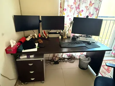 Office Desk with Triple Monitor Setup and Drawer Unit
