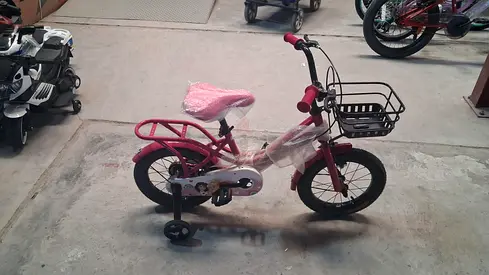 Kids 14-inch Pink  bicycle with training wheels and basket — good condition