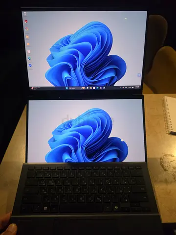 Dual-screen portable ASUS laptop with secondary display (dual-screen setup)