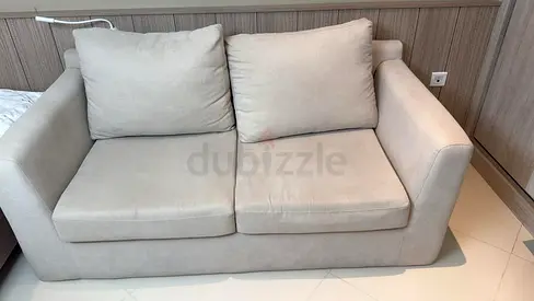 Light Beige Two-Seater Sofa - Compact and Comfortable
