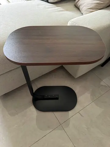 Small oval side table with metal base - dark wood finish