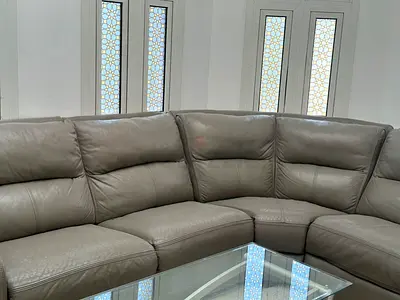 Gently Used L-Shaped Grey Leather Sofa - Corner Sectional with Glass Coffee Table Free.