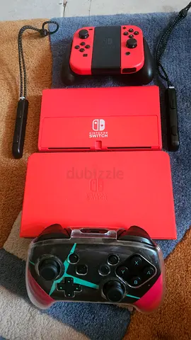 Red Nintendo Switch Lite with Joy-Cons and Third-Party Controller