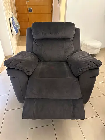 Home center. Grey recliner for sale