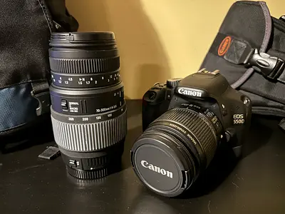Canon EOS 550D DSLR (Excellent) + 18-55mm kit lens + 70-300mm telephoto + 2 Bags + Cables + Memory