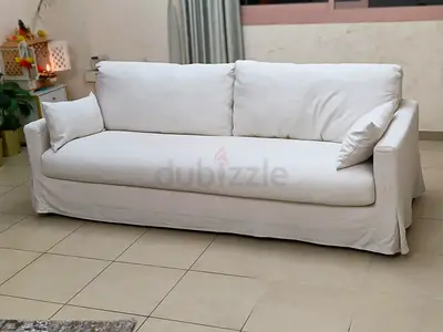 3-seater white slipcovered sofa in good condition