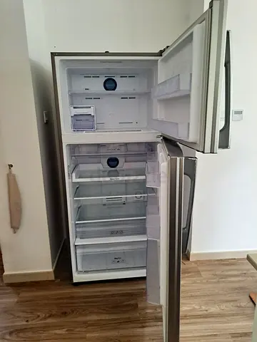 Used top-freezer refrigerator in good working condition