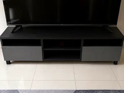 Modern low TV cabinet with storage drawers - dark woodطاولة تلفاز تفصيل من شركة ايكيا
