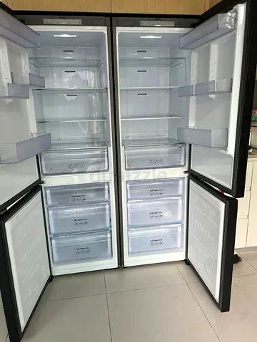 Spacious 4-Door Refrigerator Freezer – Good Condition