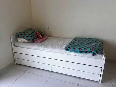 IKEA White single bed with pull-out trundle and storage drawers - good condition
