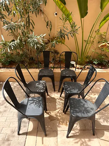 6 Black metal Tolix-style used chairs