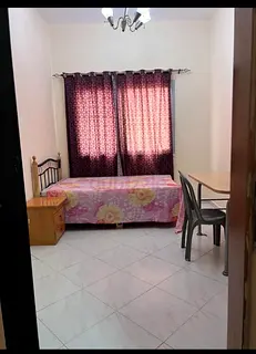 Room available for working couple/executive male or female in karama