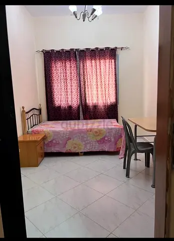 Room available for working couple/executive male or female in karama