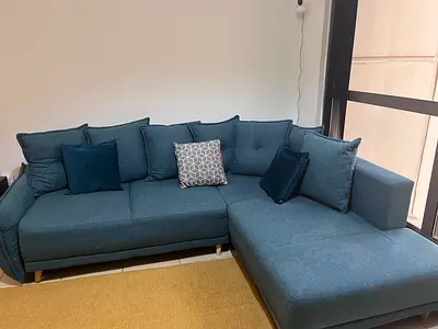 Moving out sale- Comfortable 4-Seater Blue Fabric Sofa convertible to bed in Good Condition