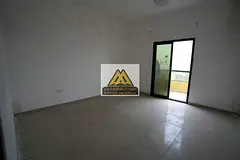A spacious 2-bedroom apartment with a living room for annual rent in Rashidiya Towers – Ajman. The