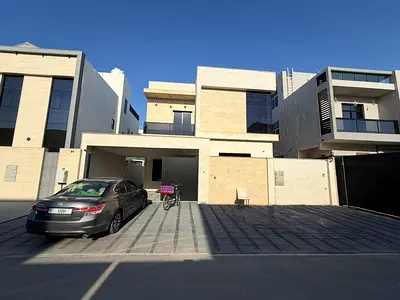 Villa for sale in Al Yasmin, Ajman. 5 bedrooms, living room, majlis, spacious kitchen, and maid's room.