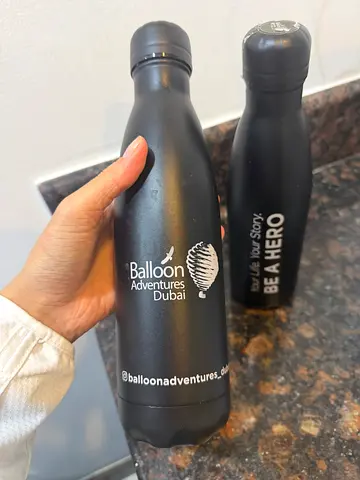Two matte black stainless steel water bottles