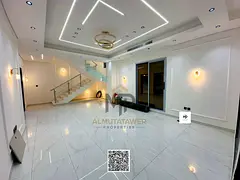 A luxurious modern villa for sale in Al Bahia, featuring a modern design and high-end finishes, wit