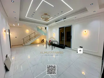 A luxurious modern villa for sale in Al Bahia, featuring a modern design and high-end finishes, wit