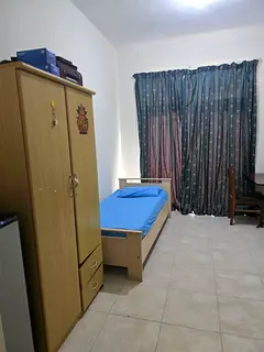 Executive Bachelor room with attached bathroom and balcony in Shabiya 9 near Dunes School