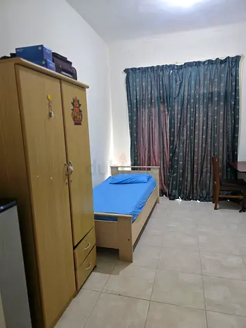 Executive Bachelor room with attached bathroom and balcony in Shabiya 9 near Dunes School